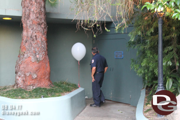 A member of the Disneyland Fire Department with a weather balloon that will be used later to check the conditions for fireworks.