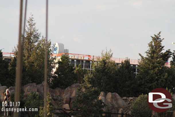 The Battle Escape show building is visible through/above the trees.