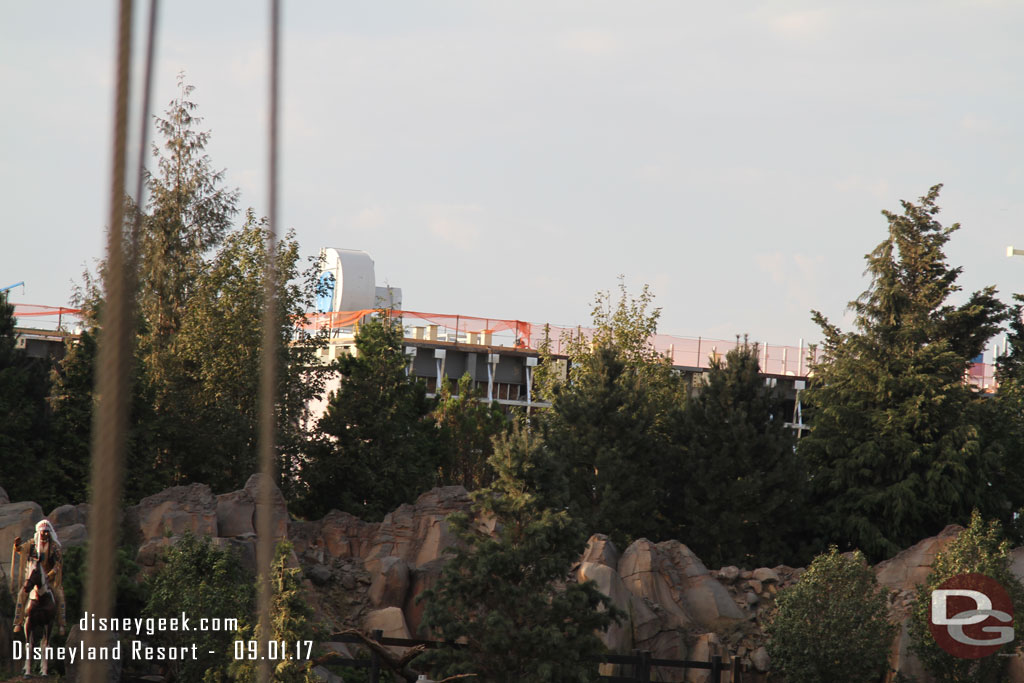 The Battle Escape show building is visible through/above the trees.