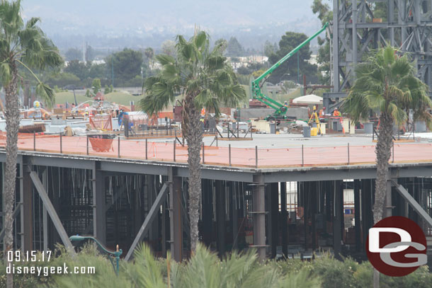 The roof of the Millennium Falcon building looks to be mostly poured now.