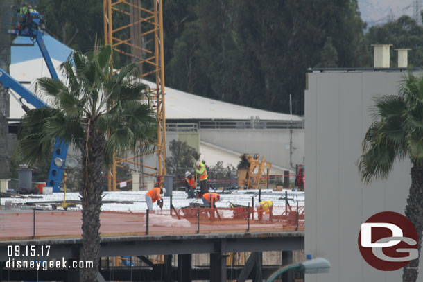 Crews working on  the roof of the Millennium Falcon building.