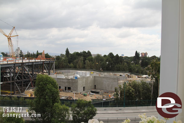 The concrete building to the right has no real visible progress since last visit.