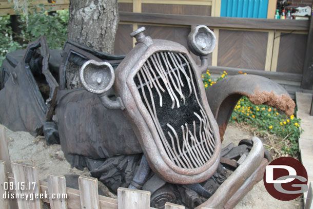 In front of Radiator Springs Curios is this old/ghost car wreck.