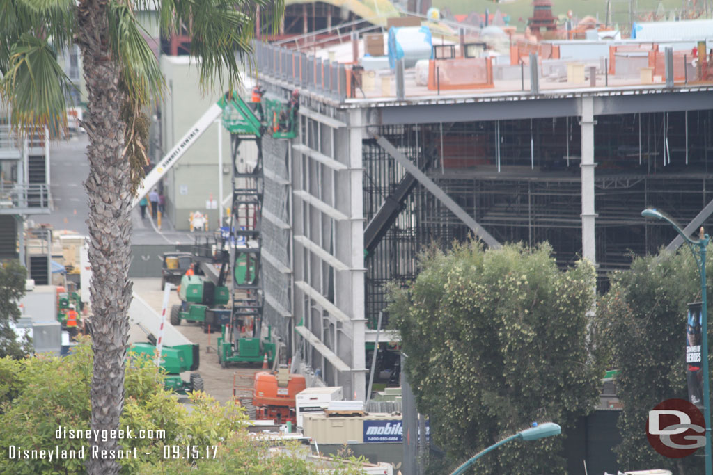 Preparations for the exterior wall of the Millennium Falcon show building along the backstage road.