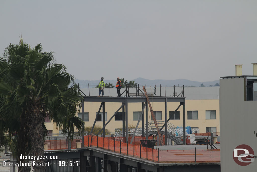 A team standing on one of the structures on the roof.