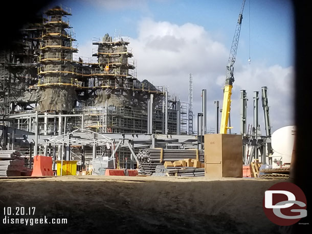 Looking through cracks in the fence at Star Wars: Galaxy's Edge construction from the Big Thunder Trail.  