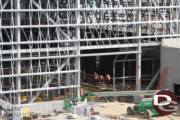 Inside a crew is working on preparations for the hanger floor.