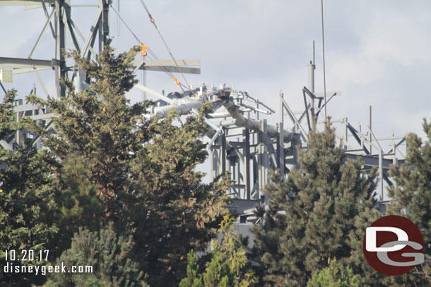 More support steel rising over the trees.