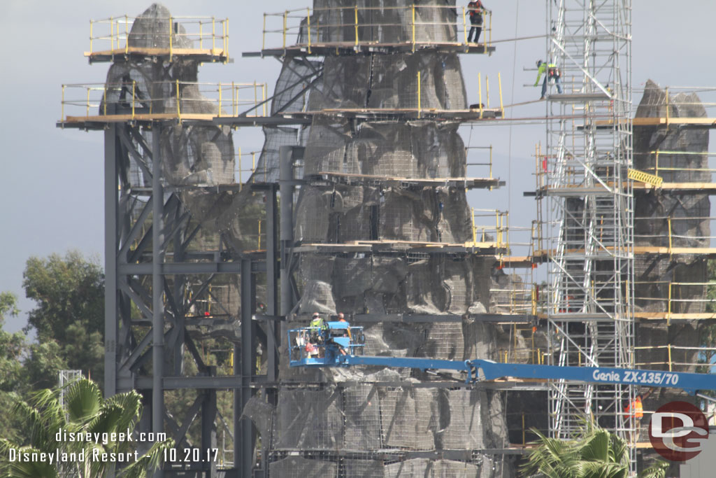 The workers help to get a senses for the scale.