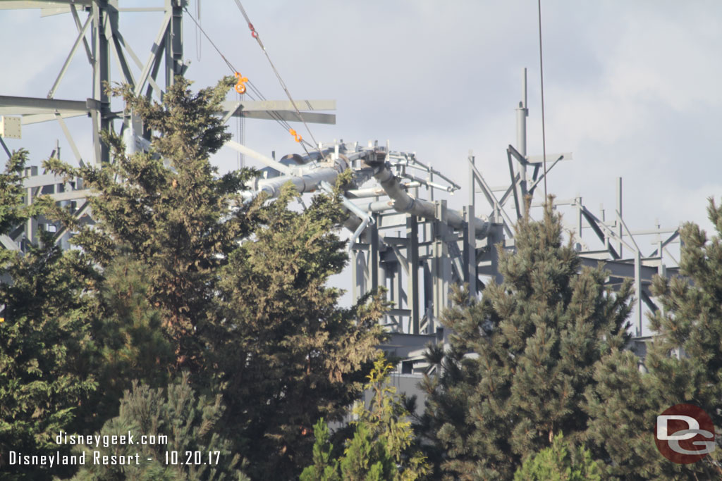 More support steel rising over the trees.