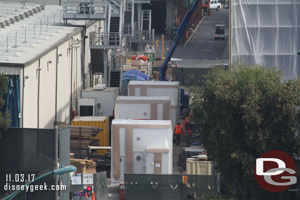 Backstage several air handling units for the HVAC system are waiting to be lifted onto the roof of the Millennium Falcon show building.