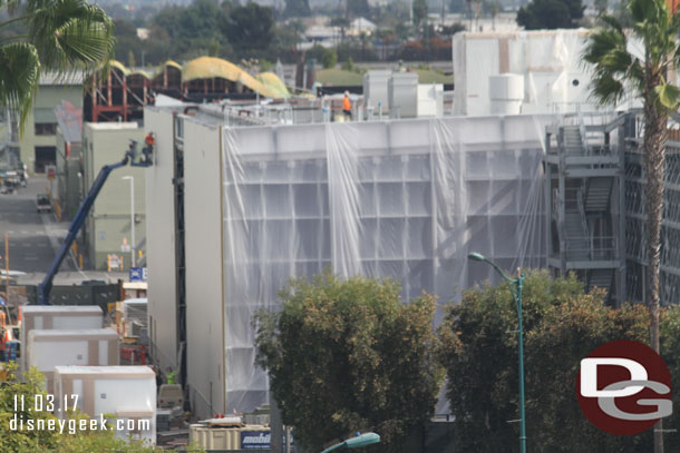 Assuming the plastic is because they are treating the steel.  Interesting how they left a strip open in the middle, assuming for construction access, but maybe they are working from the ends inward.