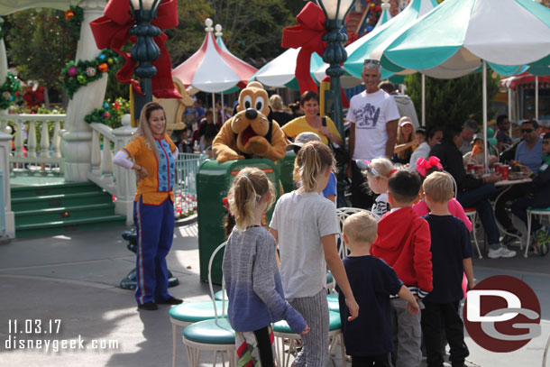 Pluto was leading a group of kids in a came of musical chairs.  He was supplying the beat.