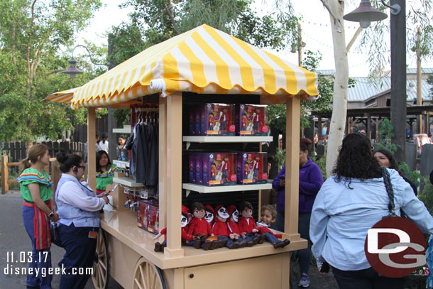 A cart with Coco merchandise.