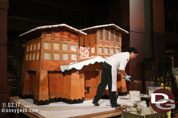 The gingerbread house is under construction in the lobby.