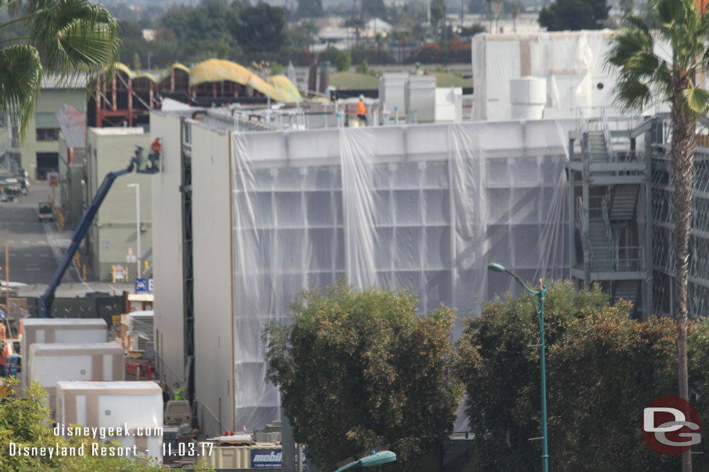 Assuming the plastic is because they are treating the steel.  Interesting how they left a strip open in the middle, assuming for construction access, but maybe they are working from the ends inward.