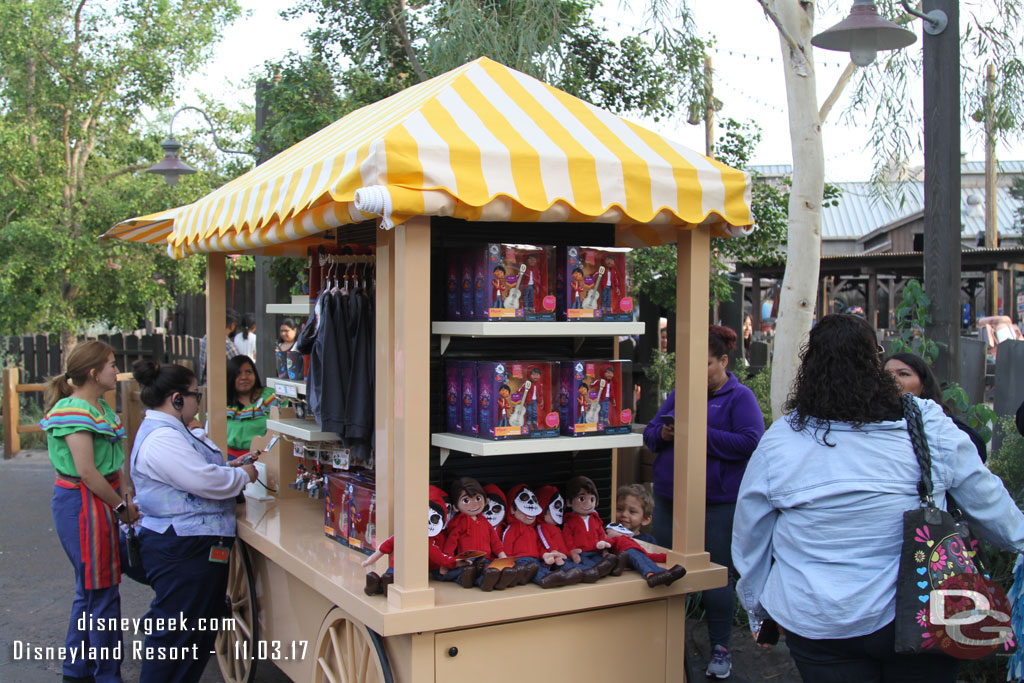 A cart with Coco merchandise.