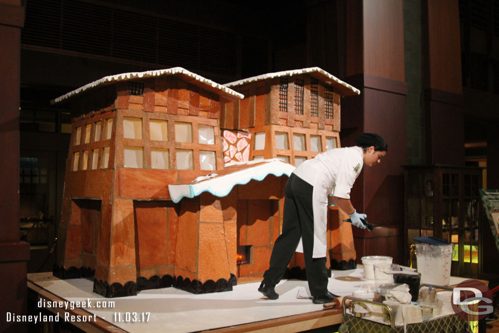 The gingerbread house is under construction in the lobby.