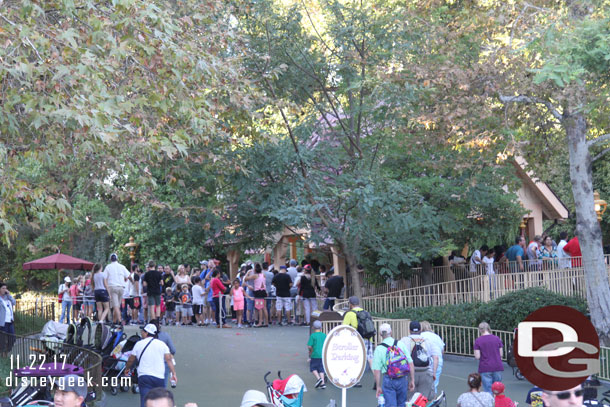 The queue for the Toon Town station fills an extended area.