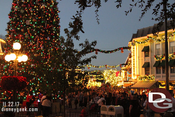 Main Street USA at Disneyland was alive with activity as always.  Healthy queues for pictures around the tree.