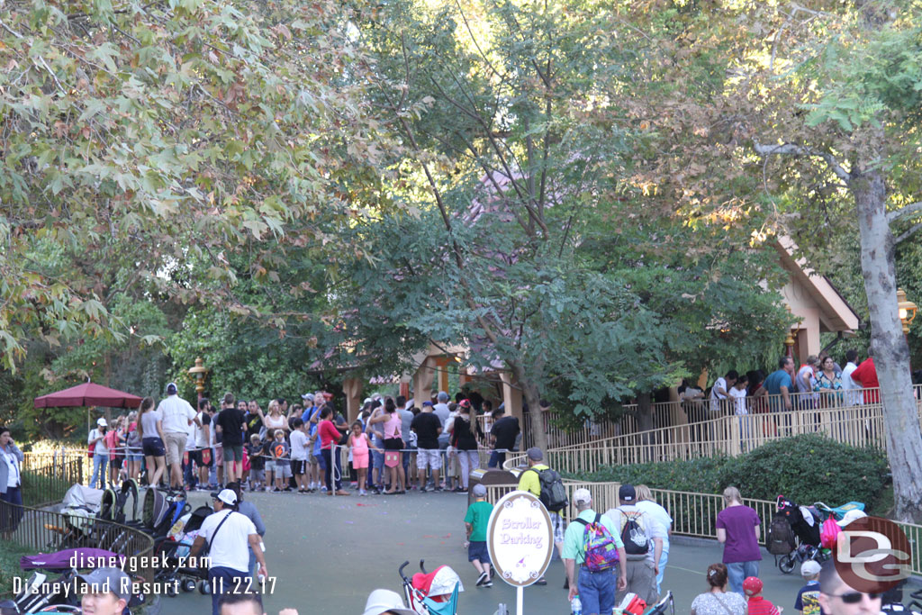 The queue for the Toon Town station fills an extended area.