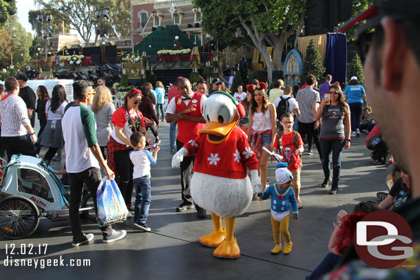 Donald Duck found a small fan and was leading them around Town Square.