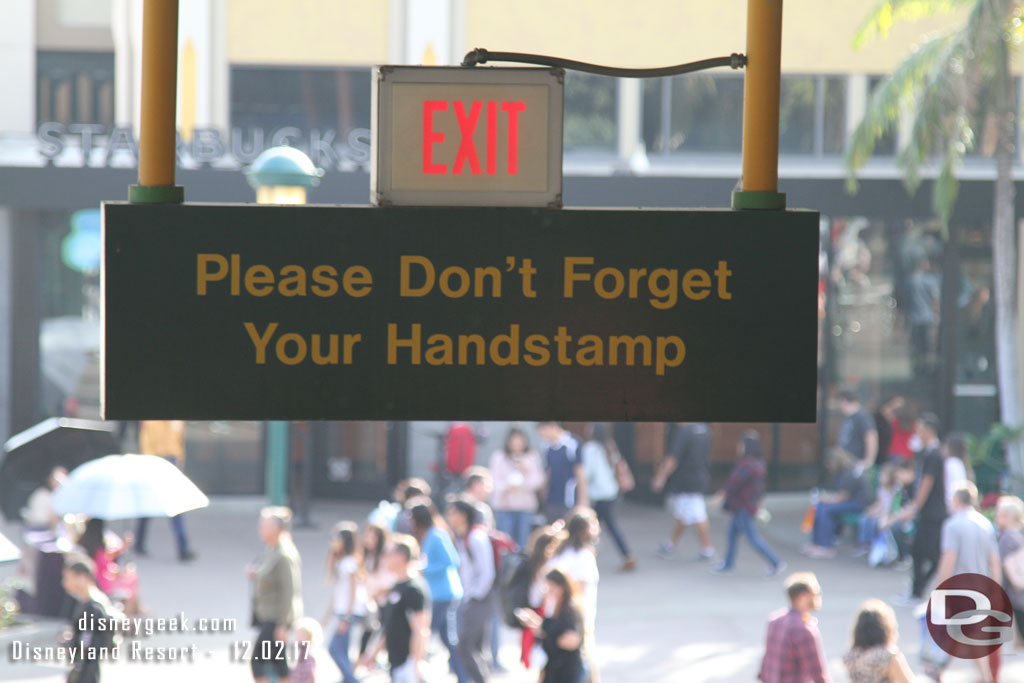 The signs at the Downtown Disney Monorail station need to be updated..  handstamps are no longer used at the Disneyland Resort.