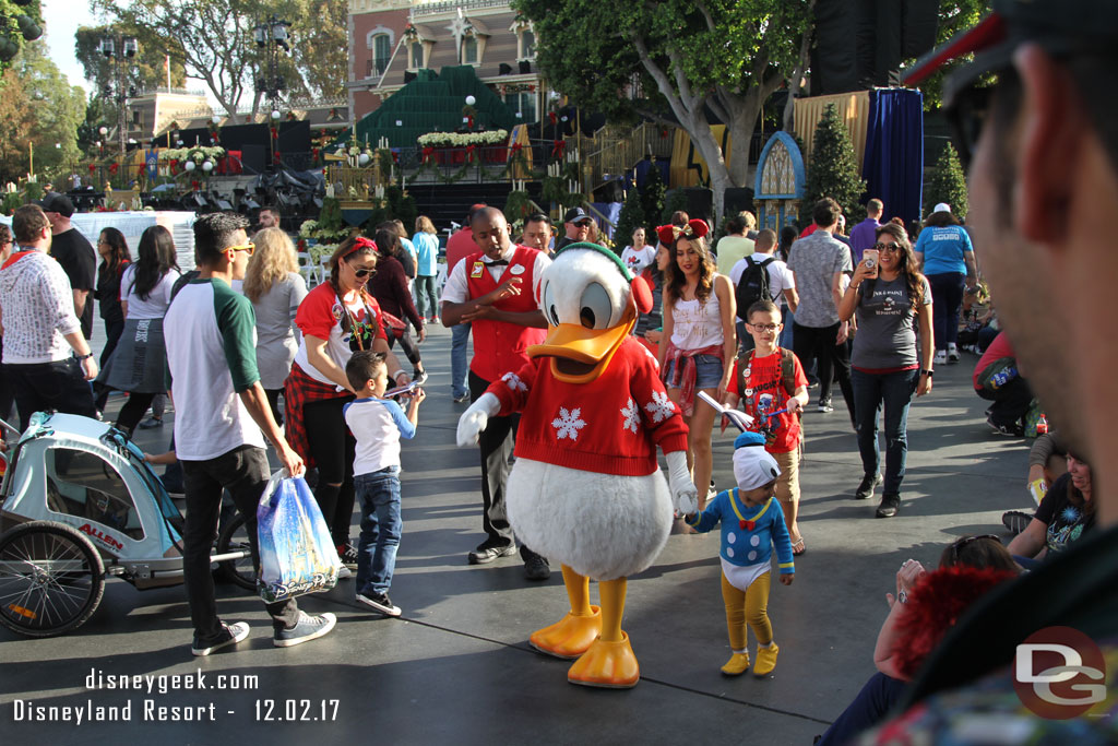 Donald Duck found a small fan and was leading them around Town Square.