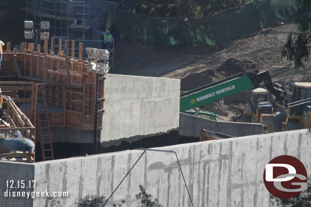 Looks like they are going to back fill some of the area between the walls with dirt.  Notice the black sealant that is visible.