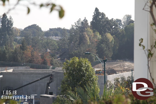 Toward Critter Country they are back filling the area between the concrete structure and backstage wall with dirt.