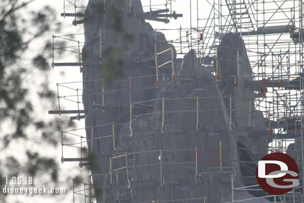 Interesting how it looks like the scaffolding floor is removed on the left peak.  Maybe so they can see the sculpting work clearly?  Seems it should stay until painting is complete. 