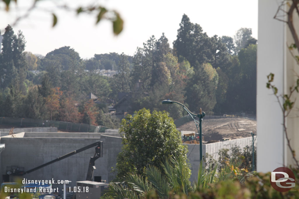 Toward Critter Country they are back filling the area between the concrete structure and backstage wall with dirt.