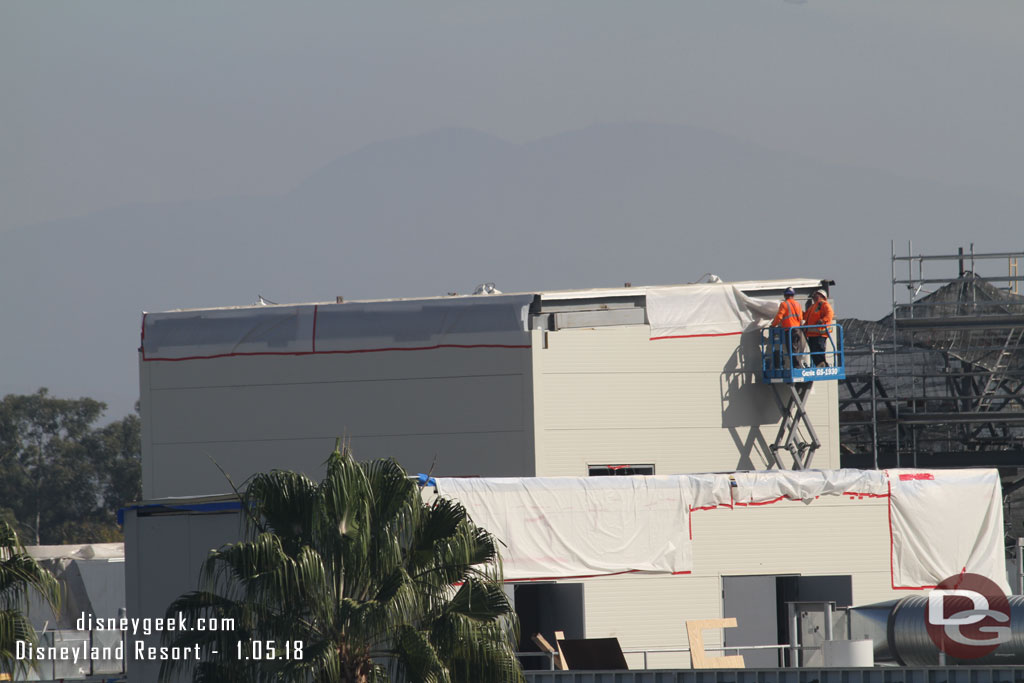 Crews working on the structures on the roof of the Battle Escape Building.  Could not tell if they were preparing it for the rain predicted for next week or if they were finishing it up.