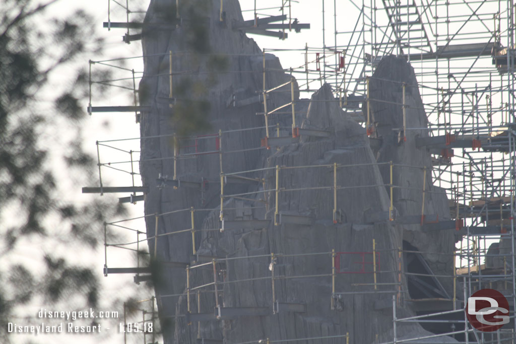 Interesting how it looks like the scaffolding floor is removed on the left peak.  Maybe so they can see the sculpting work clearly?  Seems it should stay until painting is complete. 