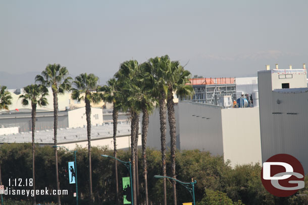 The exterior siding is now up on all the visible portions of the Millennium Falcon building.  The corner was not last week.