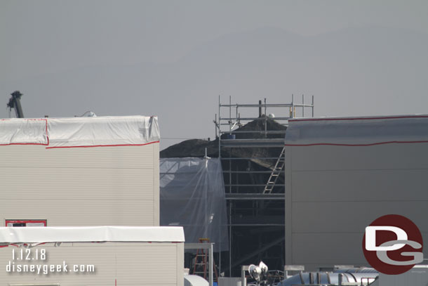 Looks like they are preparing for concrete on the rock work visible between the two structures on the roof of the Battle Escape building.