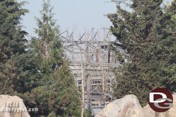 Through the trees steel from the market/village and more rock work supports is visible