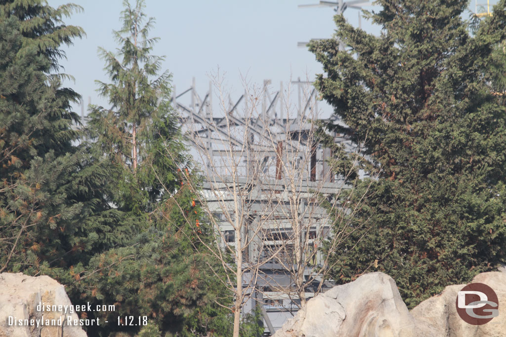 Through the trees steel from the market/village and more rock work supports is visible