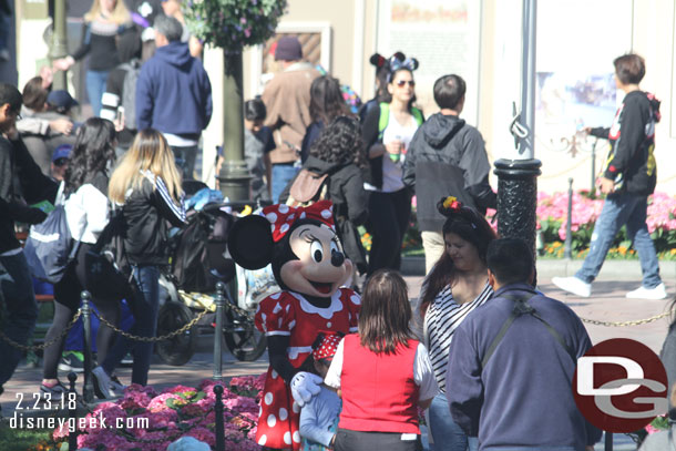 Minnie greeting guests in Town Square.