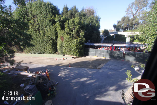 Concrete is poured on a portion of the backstage road leading to the new parade gate.  Here you can see the train passing by.