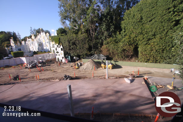 Guessing those posts will be for the new gate.. if so you can see how far back they are from the old location.  This gives a larger space for the small world queue between the new concrete and the attraction.  Wonder if stroller parking will be moved over here too.  Hard to tell how big that area really.