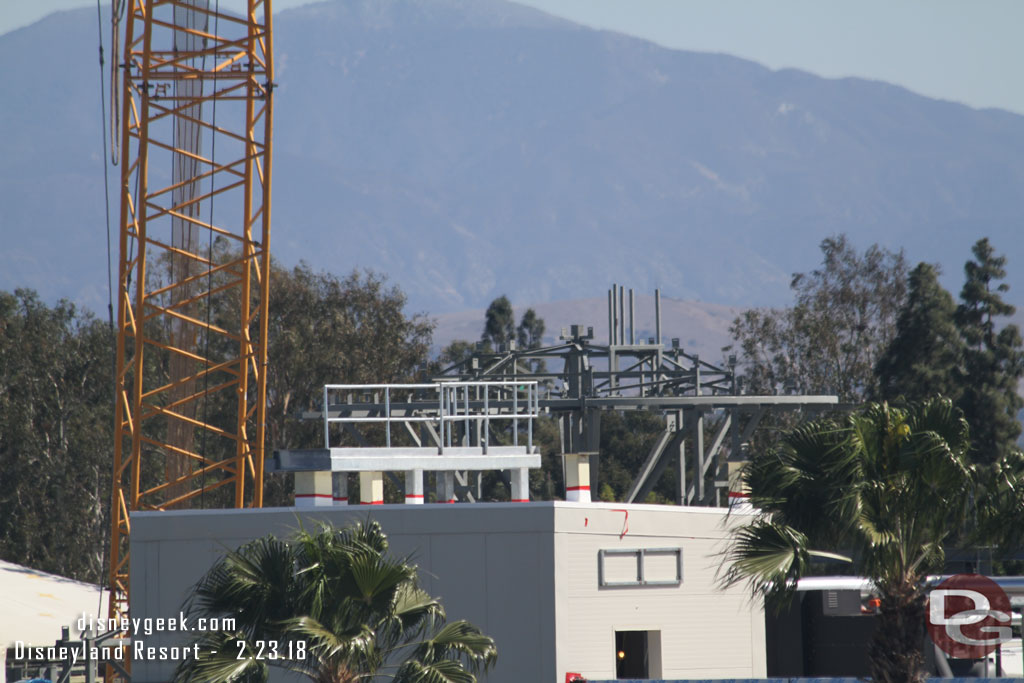 A structure on the roof starting to take shape and beyond it the steel from the village rising up.