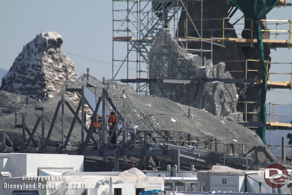 Crews working on assembling the mesh on this section.