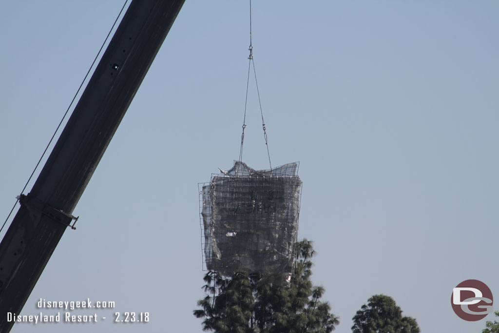 More wire mesh being lifted into place.