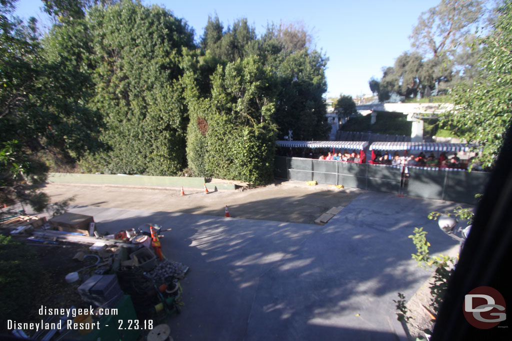 Concrete is poured on a portion of the backstage road leading to the new parade gate.  Here you can see the train passing by.