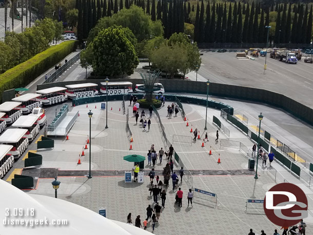 A wider view of the tram stop.  The barriers on the right are for an extended queue for security.  The tram area on the left is for drop off only.