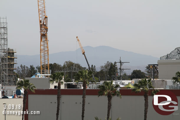 More of the village rising up above the roofline.