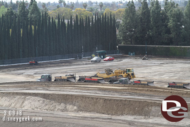 Dump trucks staged waiting to remove dirt.