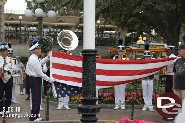 Folding the flag.