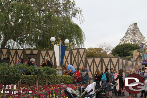 The queue for Casey Jr spills out to the walkway since the walls take up much of the queue space.